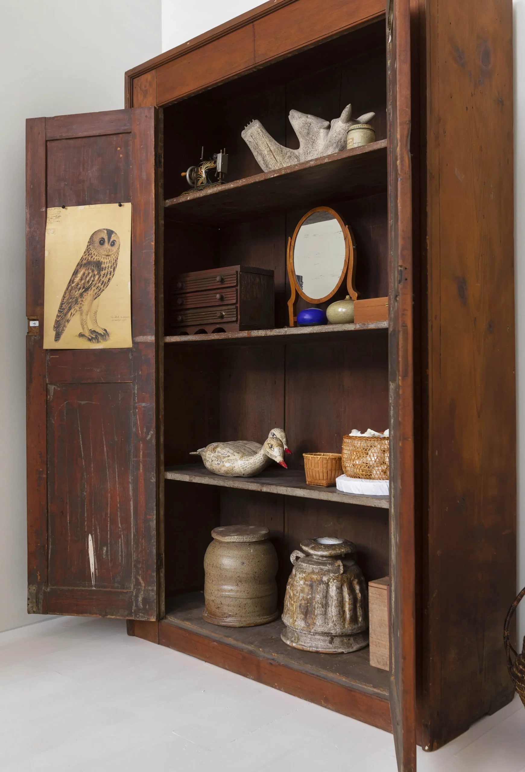Various objects in antique cabinet owned by Lenore Tawney